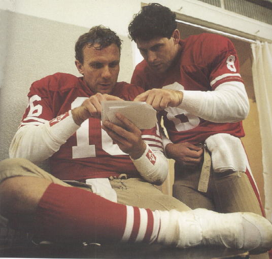 Joe and Steve looking over a Polaroid of a play.